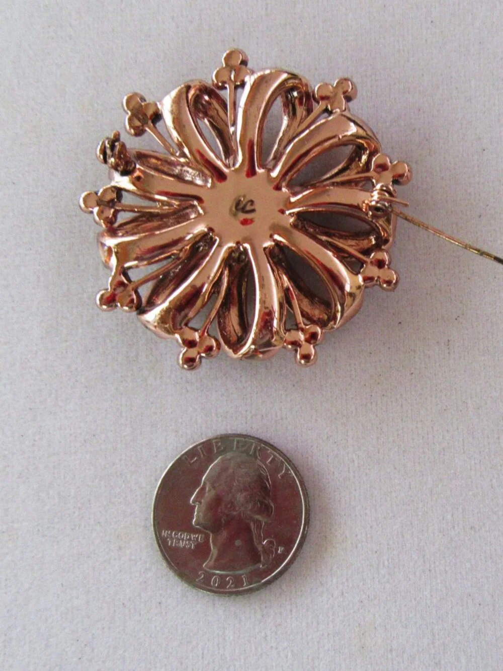 Liz Claiborne copper ribbon brooch with red & pink rhinestones